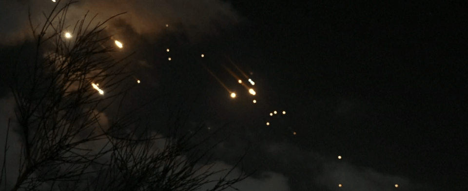 The flight’s cockpit captured this terrifying footage of Iran’s rockets passing over Israel.